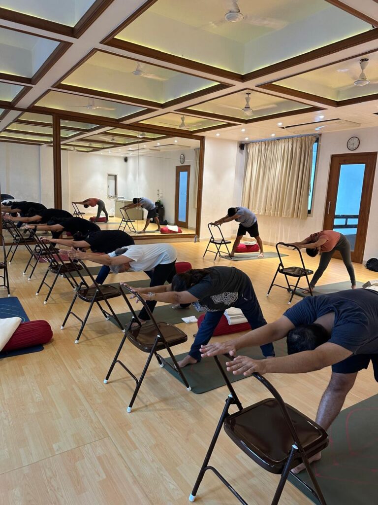 Group yoga session in Juhu Mumbai with certified yoga instructor